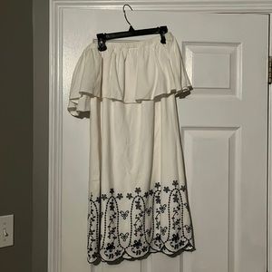 Strapless white dress with flower patterns at bottom. Worn twice.